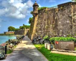 The Paseo del Morro starts from the dry moat and leads to the Gate of San Juan. Some people also fly the kite on the great lawn which is a local old t